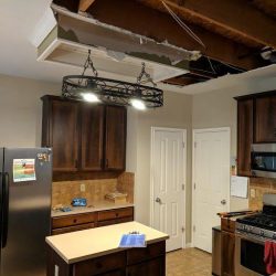 A water leak in the bathroom above the kitchen damaged the kitchen ceiling requiring remodeling work